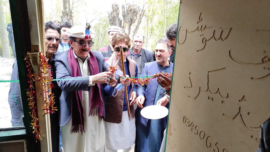 Ribbon-cutting ceremony at the inauguration of a community building in Chitral