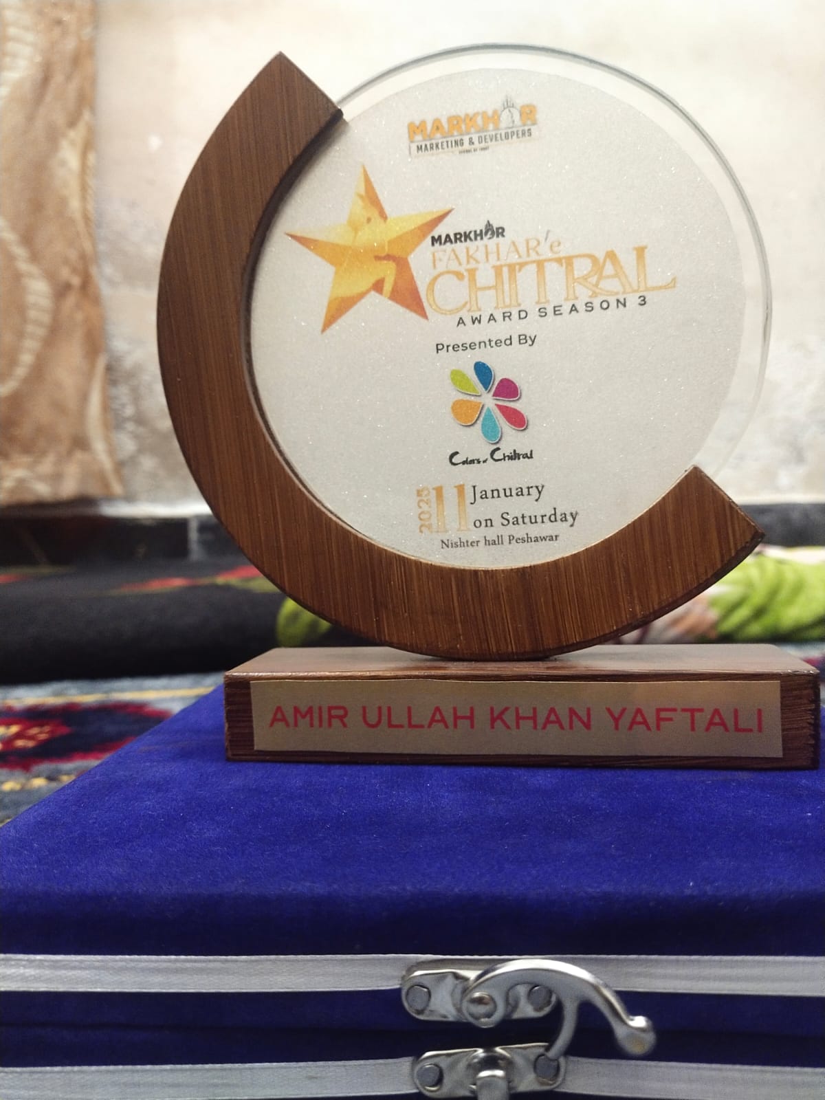 Fakhar-e-Chitral Award trophy presented to Amir Ullah Khan Yaftali in 2025